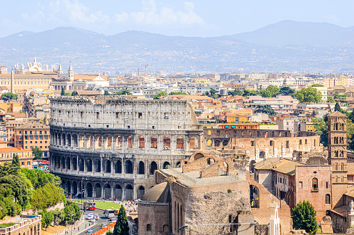 Panoramic view of Rome from the Vittoriano with the Colosseum, the Basilica of Maxentius, the Church of Santa Francesca Romana and the Basilica of Saint John Lateran in the distance
