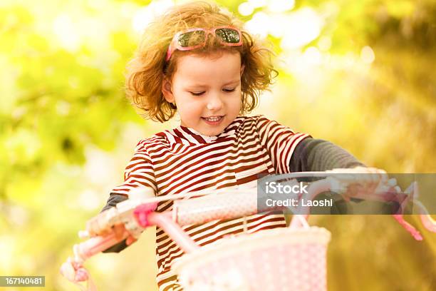 Girl Riding A Bike Stock Photo - Download Image Now - Cycling, Pink Color, Summer