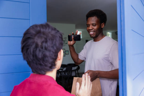 istock Man received his food from delivery service. 1671405049