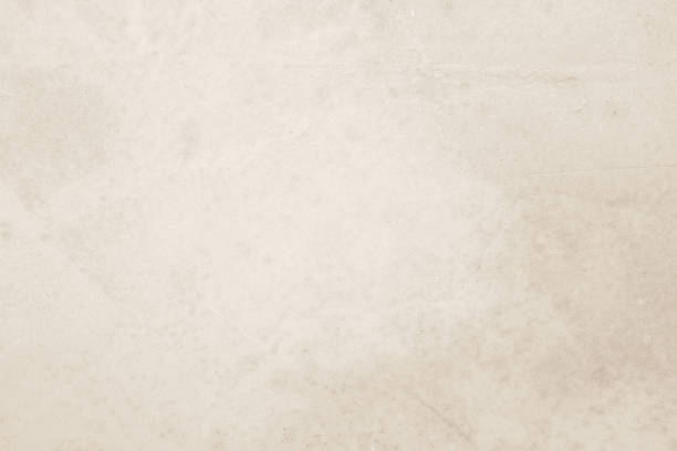 istock Colour old concrete wall texture background. Close Up retro plain cream color cement wall background texture. Design paper vintage parchment element show or advertise or promote product on display. 1671405937