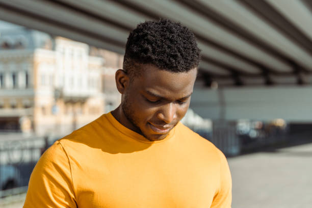 istock Authentic portrait of handsome calm African American man looking down 1671406480