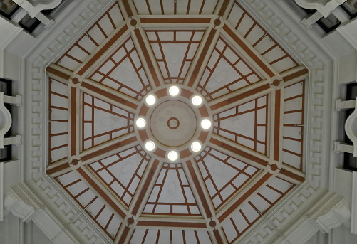 Inner view of the Flinders Street Railway Station central dome octagonal plan covering the main entrance ticket hall built in AD 1910 in Edwardian style, repainted in AD 2017. Melbourne-VIC-Australia.