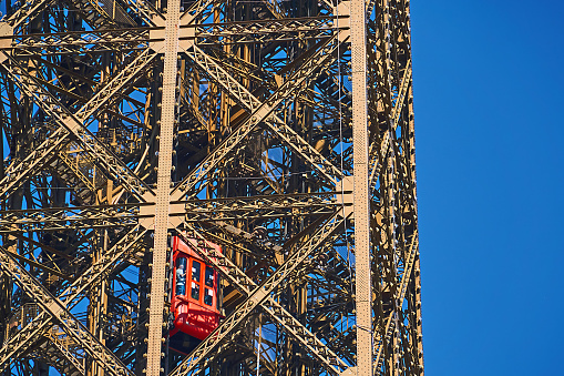 Paris, France - July 11, 2023: Tourists take the elevator to the top of the Eiffel Tower.