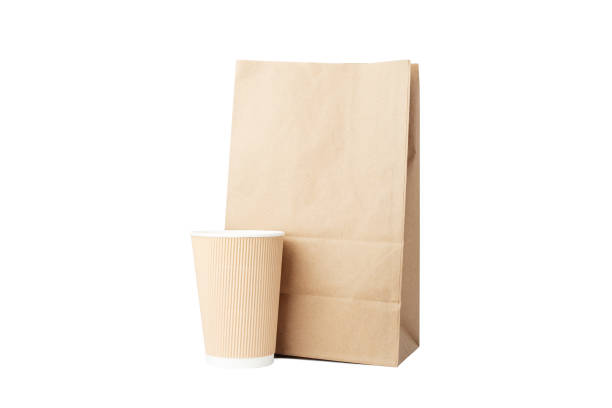 istock take away bag with a cardboard cup isolated, lunch delivery, eco-friendly packaging, grocery shop, brown kraft packet 1671474834