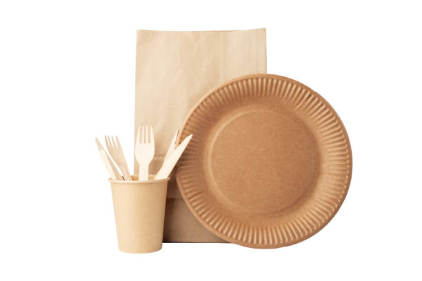 istock Eco-friendly bamboo tableware set isolated, Biodegradable cardboard plate and wooden utensils for dining with hot drink cup and craft bag 1671474836