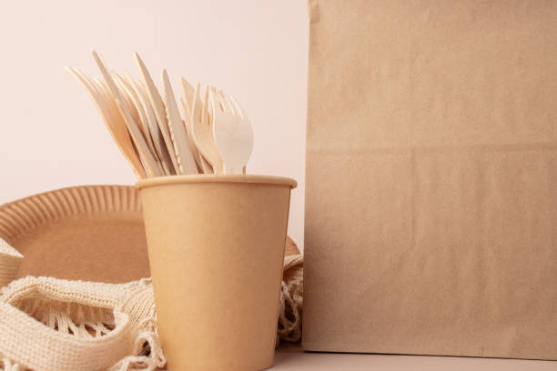 istock Disposable bamboo utensils for eco-friendly catering, eco tableware, biodegradable ecological organic cardboard plates, eco packaging, Take away bag, food delivery, responsible wrapping 1671475348