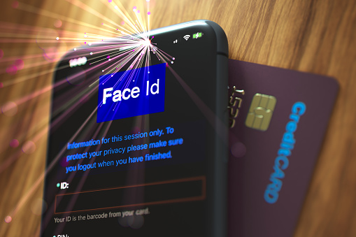 Concept. Mobile phone being accessed using face id identity.