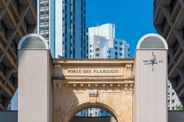 Photo of The Porte des Flamands in the 19th arrondissement of Paris, a door dating from 1850 and which was originally the door to a group of buildings housing workers.