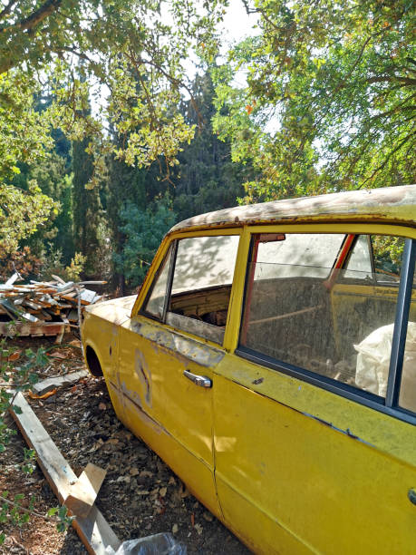 Abandoned yellow car II stock photo