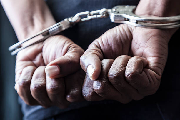 Handcuffed Person in handcuffs hostage photos stock pictures, royalty-free photos & images