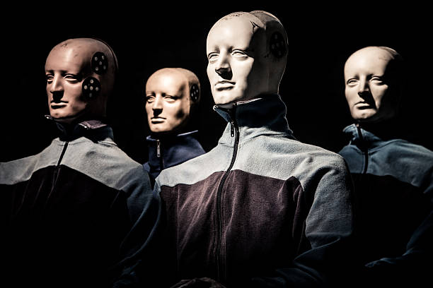 Crash Test Dummy Experiment Crash test dummies sitting in the spotlight waiting for the crash test. crash test dummy stock pictures, royalty-free photos & images