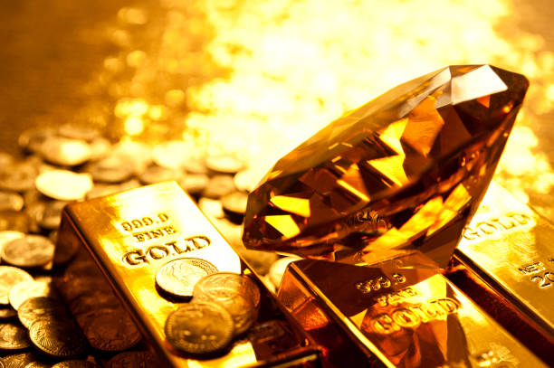 istock Amber diamond on gold bars 167155090