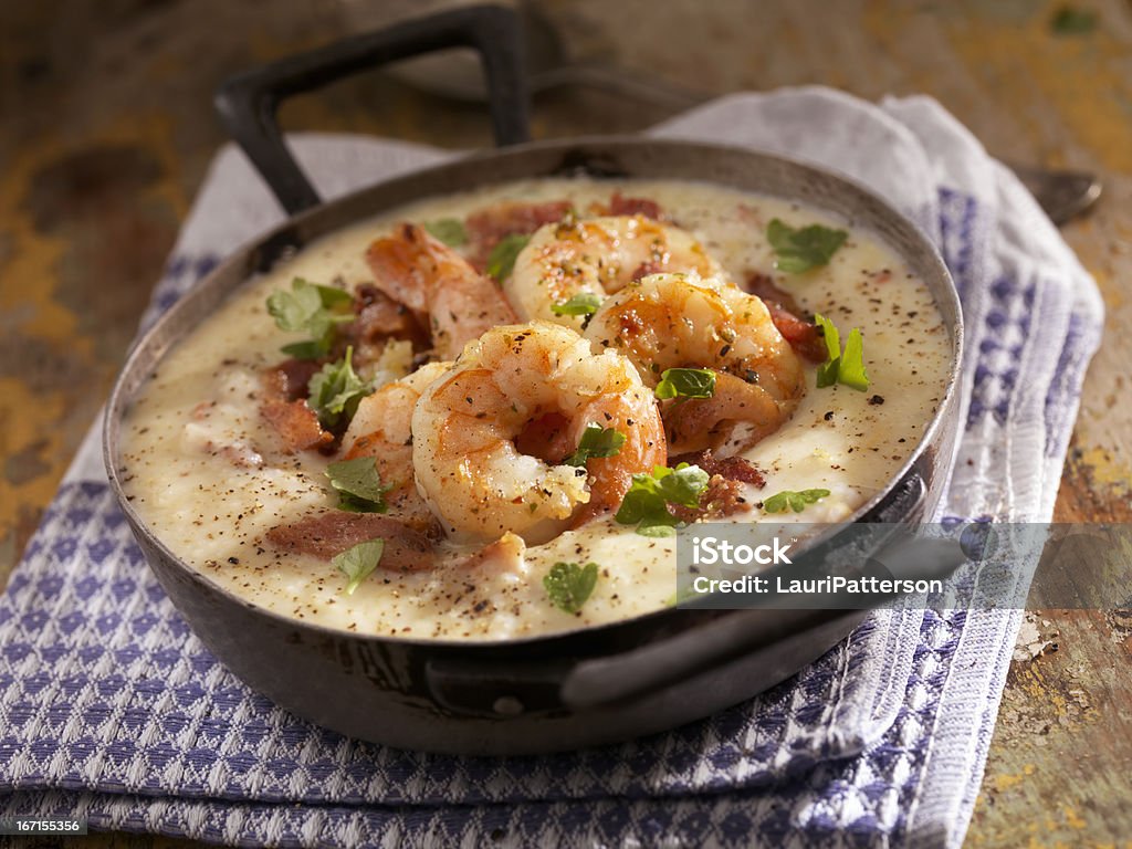 Shrimp and Grits Creamy Grits with Shrimp, Bacon and Fresh Parsley - Photographed on Hasselblad H3D2-39mb Camera Shrimp - Seafood Stock Photo