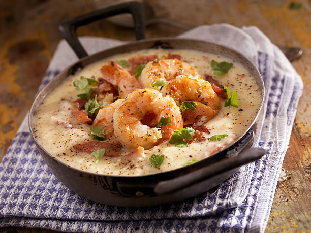 Shrimp and Grits Creamy Grits with Shrimp, Bacon and Fresh Parsley - Photographed on Hasselblad H3D2-39mb Camera grits stock pictures, royalty-free photos & images
