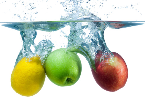 Fresh Apples and Lemon Splash Into Cool Water