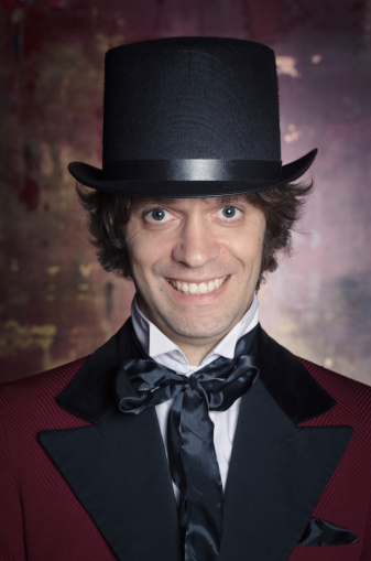 A sophisticated and classy looking man in a top hat