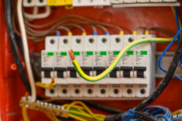istock Bare electric wire on the background of the electrical panel. 1671580497