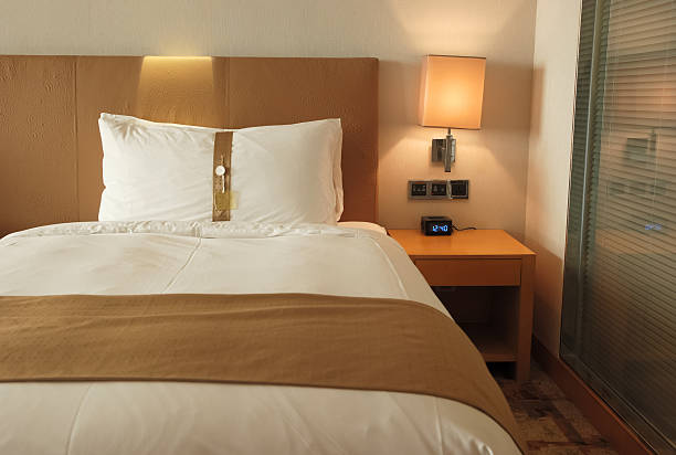 istock bed in a hotel room 167160825