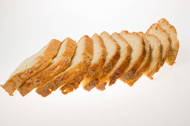 Slices of bread strung on white background stock photo