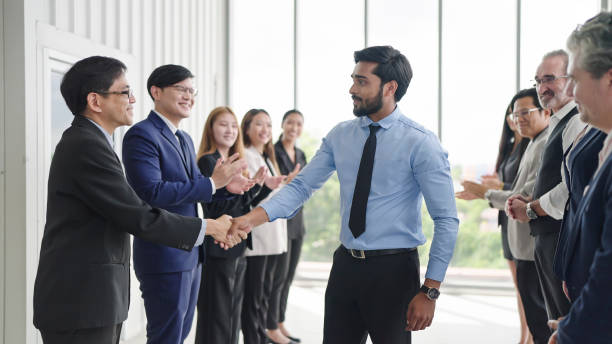 istock Successful business team is clapping. Happy business people clapping hands. Company workers applauding colleagues in corporate meeting 1671610322