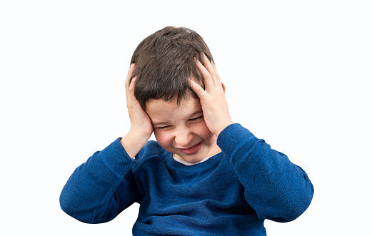 Child suffering headache isolated with white background