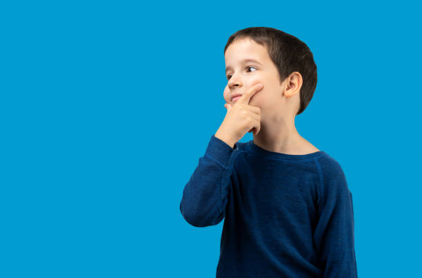 istock Little child looking away 1671620506