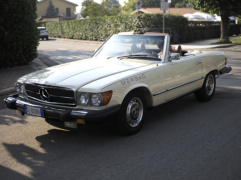 Morimondo, Italy - September 10, 2023: Parade of vintage cars through the streets of the city