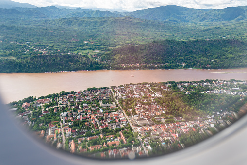 View from airplane over mountains and river, Luang Prabang, Laos.