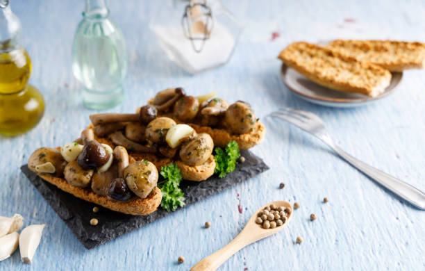 Mushrooms prepared with garlic , fresh butter and parsley served as a appetizer.