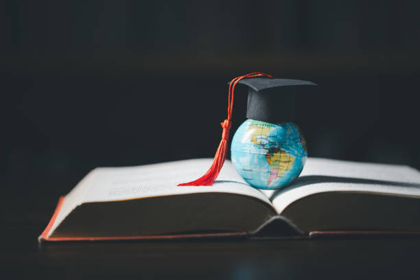 istock Graduated study abroad international Conceptual, Graduation hat on top Earth globe model map.Congratulations to graduates, Studies lead to success in world wide.Back to School. credited world by NASA 1671685789
