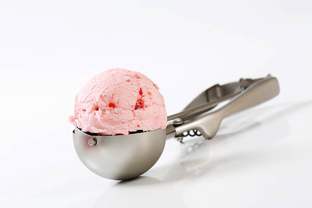 strawberry ice cream on a scooper scoop of fresh strawberry ice cream on a scooper scoop shape photos stock pictures, royalty-free photos & images