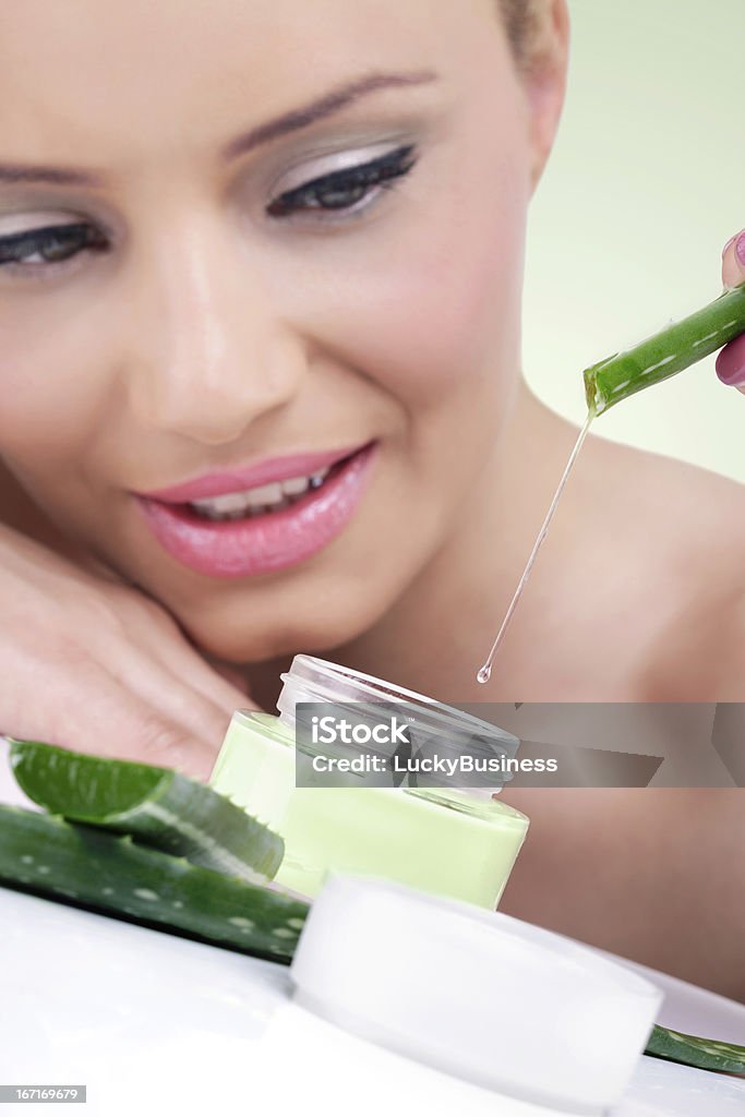 Young woman with natural aloe vera cream Young woman with natural aloe vera cream ready for beauty treatment Adult Stock Photo