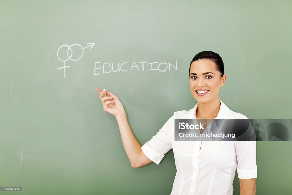 sex education female teacher pointing at sex education written on the chalkboard Sex Education Stock Photo