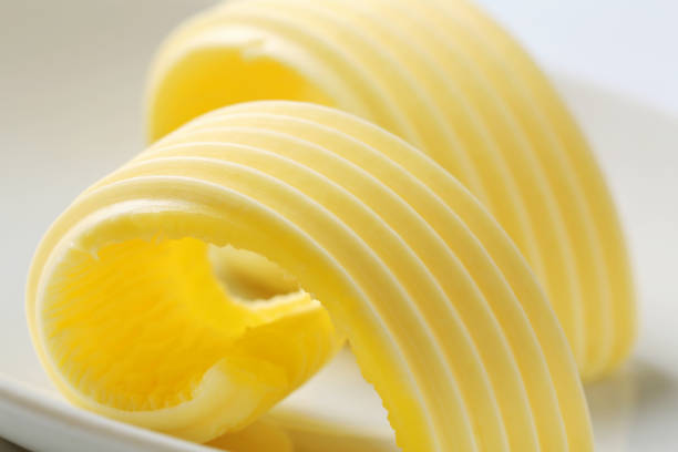 Butter curls on a plate stock photo