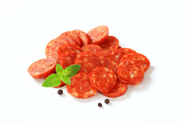 istock Heap of sausage slices isolated on white 167170625