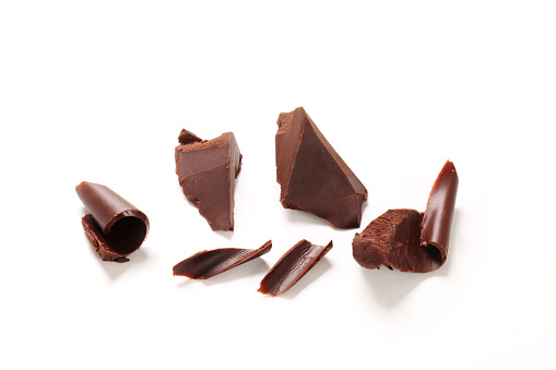 Pieces of chocolate curl isolated on white