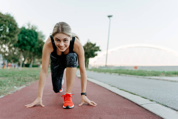 istock Young Caucasian female runner in starting position 1671708001