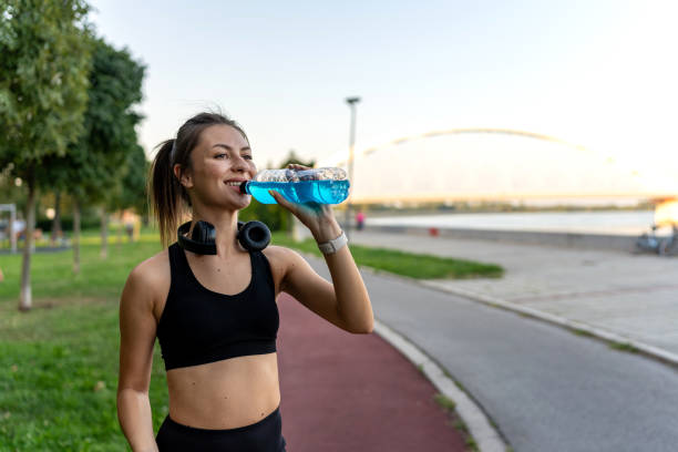 istock Female jogger stopping for a refreshment 1671708048
