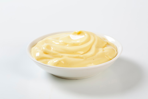 smooth vanilla cream in a white bowl