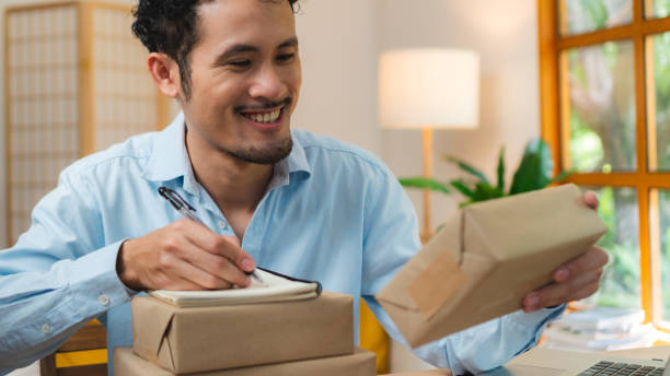 istock Asian Start up SME owner checking the parcel from customer via online shopping platform ,work from home e-commerce business packing and delivery concept 1671720935