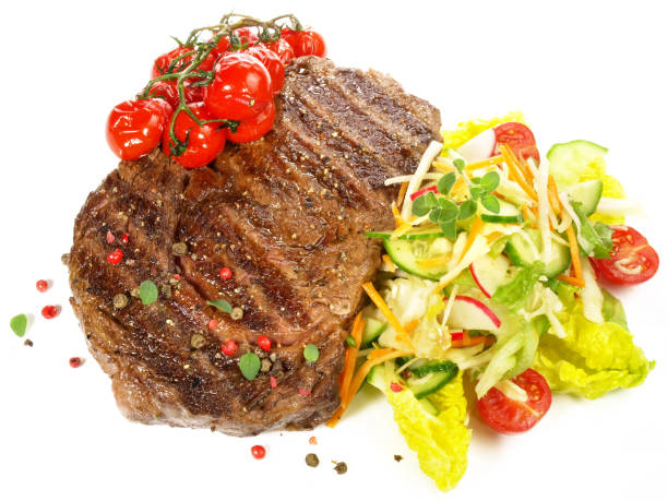 istock Medium Beef Steak with mixed Lettuce and grilled Cherry Tomatoes 1671741445