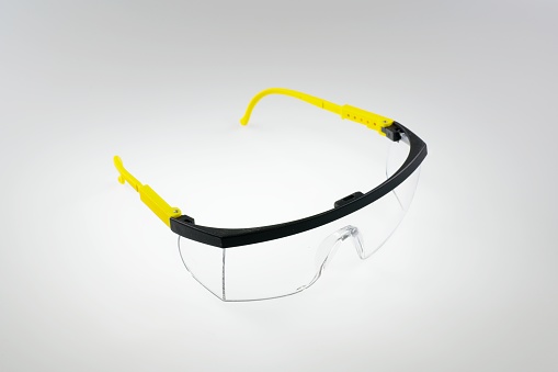 Pair of safety goggles on a background