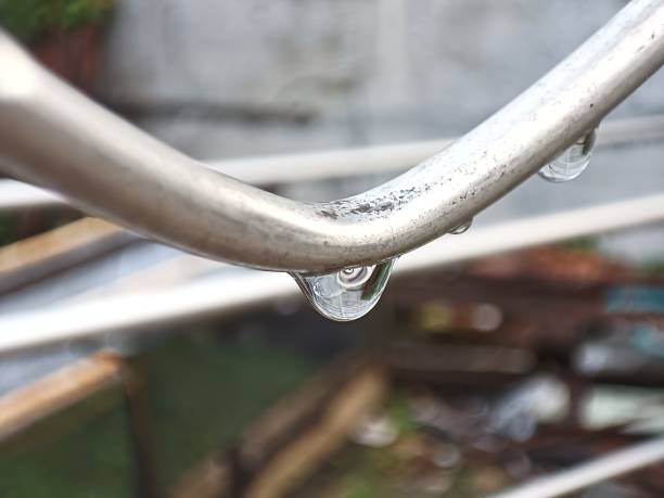 istock macro closeup of raindrops on a stainless steel pole 1671783555