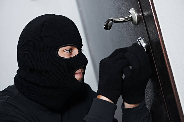 istock burglar thief at house breaking 167184563