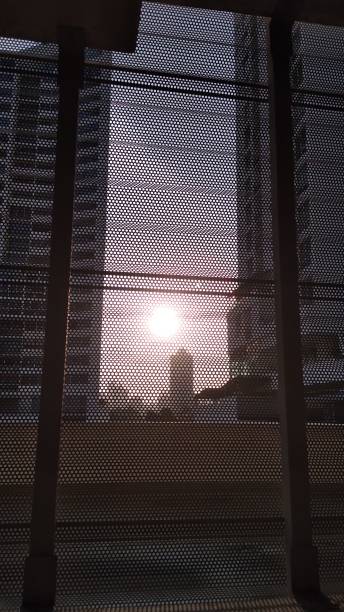 istock sunset in the city seen through window 1671846036