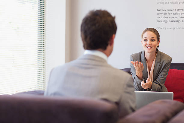 Business people talking face to face in lobby  interview event stock pictures, royalty-free photos & images