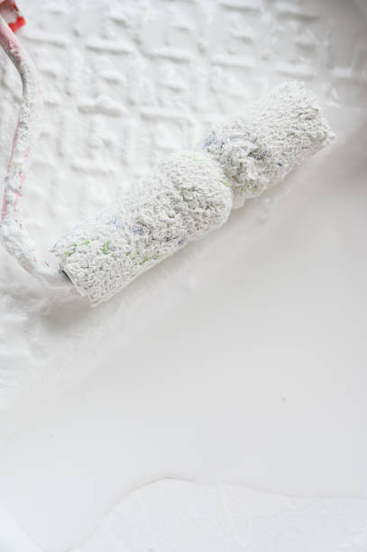 istock Close up of paint roller in tray. 1671864200