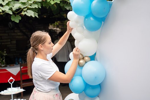 Party agency making party decorations with balloons. Small business
