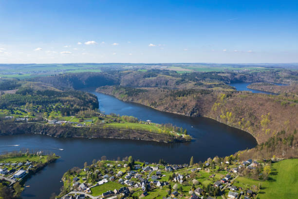 istock panoramic view of small lake with a lakeside village 1671976470