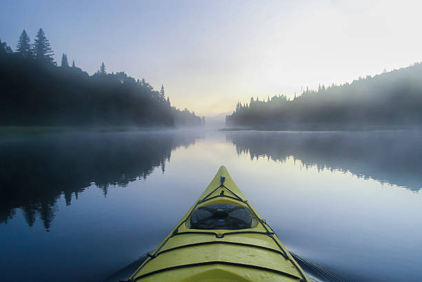 istock Kayak surfer on a  misty lake 167199728